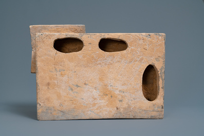 A Chinese earthenware model of a stable and five animals, Han