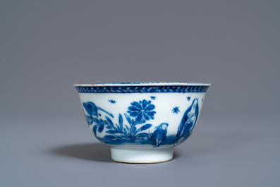 A Chinese blue and white 'mother with child' cup and saucer, Kangxi