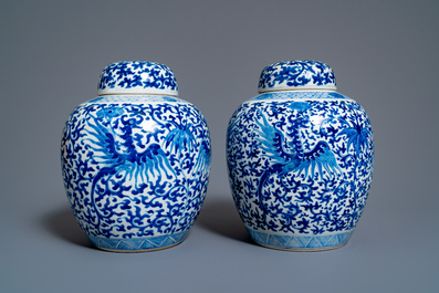 A pair of Chinese blue and white covered 'phoenix' jars, Kangi mark, 19th C.