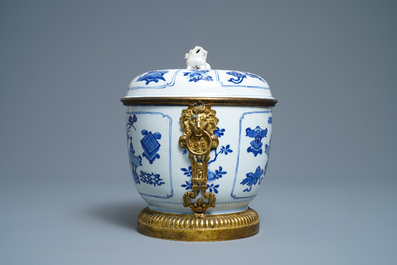A Chinese blue and white bowl and cover with gilt bronze mounts, Kangxi