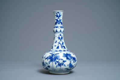 A Chinese blue and white bottle vase with figures in a landscape, Transitional period
