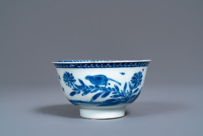 A Chinese blue and white 'mother with child' cup and saucer, Kangxi