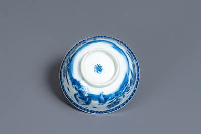 A Chinese blue and white 'mother with child' cup and saucer, Kangxi