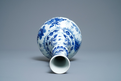 A Chinese blue and white bottle vase with figures in a landscape, Transitional period