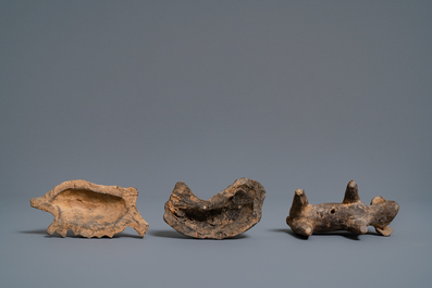A Chinese earthenware model of a stable and five animals, Han