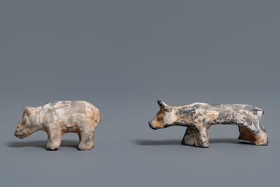 A Chinese earthenware model of a stable and five animals, Han