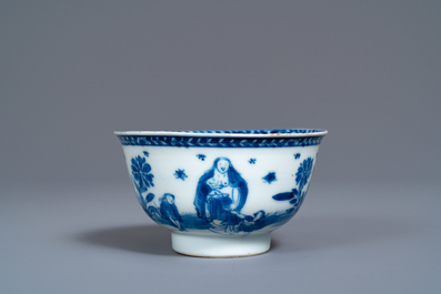 A Chinese blue and white 'mother with child' cup and saucer, Kangxi