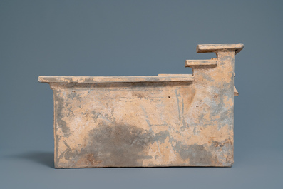A Chinese earthenware model of a stable and five animals, Han