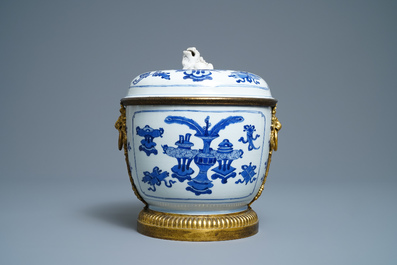 A Chinese blue and white bowl and cover with gilt bronze mounts, Kangxi