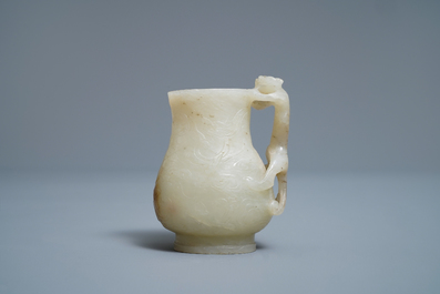 A Chinese celadon russet jade chilong-handled jug, Qing
