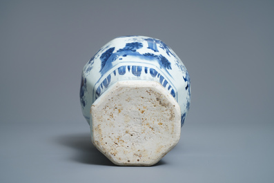 A Chinese blue and white baluster vase with figures in a landscape, Transitional period