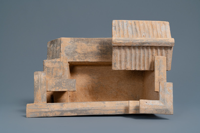 A Chinese earthenware model of a stable and five animals, Han