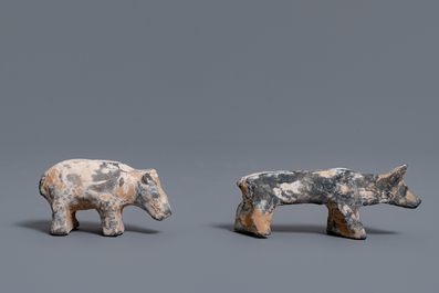 A Chinese earthenware model of a stable and five animals, Han