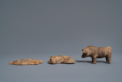 A Chinese earthenware model of a stable and five animals, Han