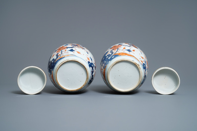 A pair of Chinese Imari-style 'qilin and phoenix' jars and covers, Kangxi