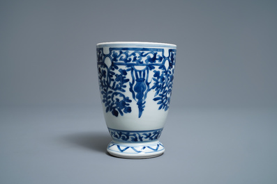 A Chinese blue and white beaker after a European silver model, Kangxi