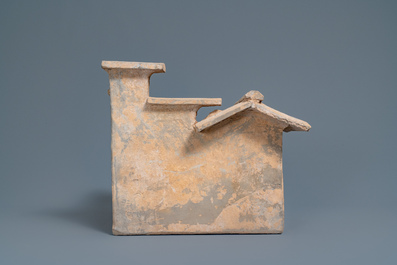 A Chinese earthenware model of a stable and five animals, Han