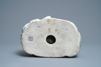 A Chinese famille rose figure of Buddha, impressed seal mark, 19/20th C.