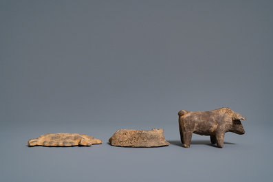 A Chinese earthenware model of a stable and five animals, Han