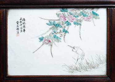 A Chinese wooden closet with 23 qianjiang cai plaques, 19/20th C.