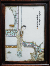 A Chinese wooden closet with 23 qianjiang cai plaques, 19/20th C.