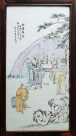 A Chinese wooden closet with 23 qianjiang cai plaques, 19/20th C.