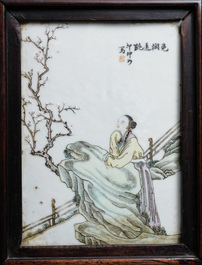 A Chinese wooden closet with 23 qianjiang cai plaques, 19/20th C.