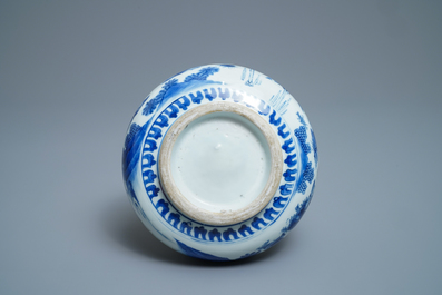 A Chinese blue and white bottle vase with figures in a landscape, Transitional period