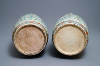 A pair of large Chinese famille verte celadon-ground vases with figural design, 19th C.