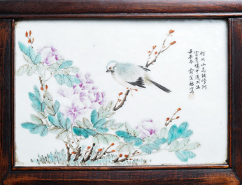 A Chinese wooden closet with 23 qianjiang cai plaques, 19/20th C.