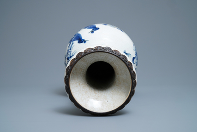 A Chinese blue, white and copper red Nanking crackle-glazed vase, 19th C.
