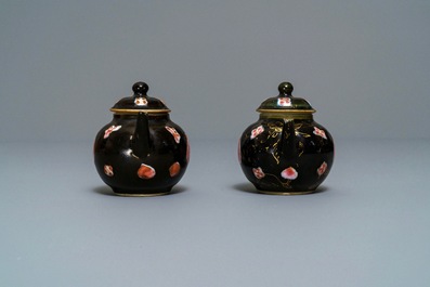 A pair of Chinese famille rose black-ground teapots and covers, Yongzheng/Qianlong