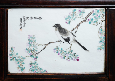 A Chinese wooden closet with 23 qianjiang cai plaques, 19/20th C.