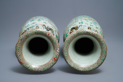 A pair of large Chinese famille verte celadon-ground vases with figural design, 19th C.