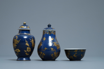 A Chinese gilt-decorated powder blue cream jug, a tea caddy and a tea bowl with roosters, Yongzheng