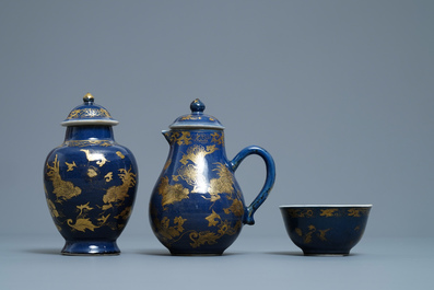 A Chinese gilt-decorated powder blue cream jug, a tea caddy and a tea bowl with roosters, Yongzheng