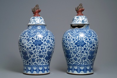 A pair of Chinese blue and white vases with faience replacement covers, Kangxi