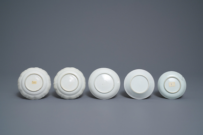 Five Chinese famille rose cups and saucers and two 'Mandarin' teapots, Yongzheng/Qianlong