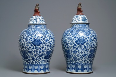 A pair of Chinese blue and white vases with faience replacement covers, Kangxi