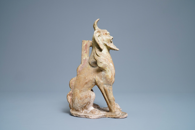 A Chinese straw-glazed stoneware 'earth spirit', Sui (581-617)
