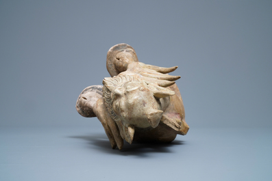 A Chinese straw-glazed stoneware 'earth spirit', Sui (581-617)