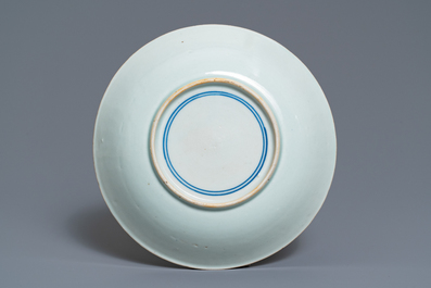 A Chinese blue and white plate with calligraphy and scholars rock, Shunzhi