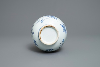 A Chinese blue and white bottle vase with floral design, Transitional period