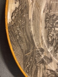 A Chinese grisaille 'Return from the hunt' dish with a coat of arms on the back, Qianlong