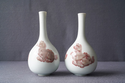 A pair of Chinese copper red 'mythical beasts' vases, Kangxi