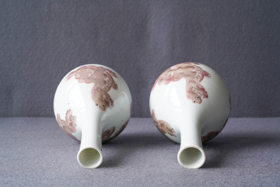 A pair of Chinese copper red 'mythical beasts' vases, Kangxi