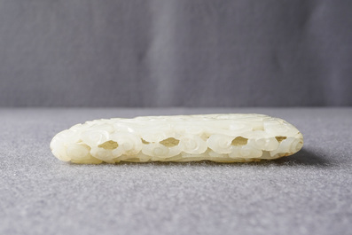 A Chinese reticulated pale celadon jade 'dragon and phoenix' carving, Ming