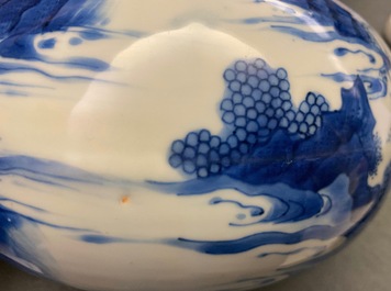 A Chinese blue and white bottle vase with figures in a landscape, Transitional period