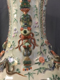 A pair of large Chinese famille verte celadon-ground vases with figural design, 19th C.