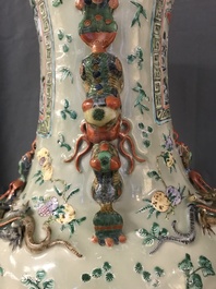 A pair of large Chinese famille verte celadon-ground vases with figural design, 19th C.